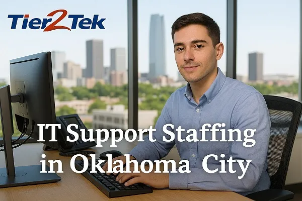 IT support professional at a desk with Oklahoma City skyline in the background, representing Tier2Tek Staffing services