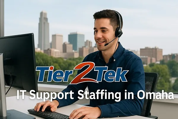 IT support professional at a desk with Omaha skyline in the background, representing Tier2Tek Staffing services