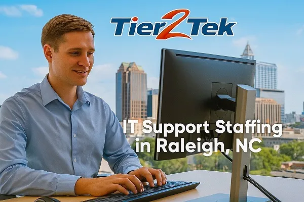 IT support staffing professional at work with Raleigh, NC skyline in the background
