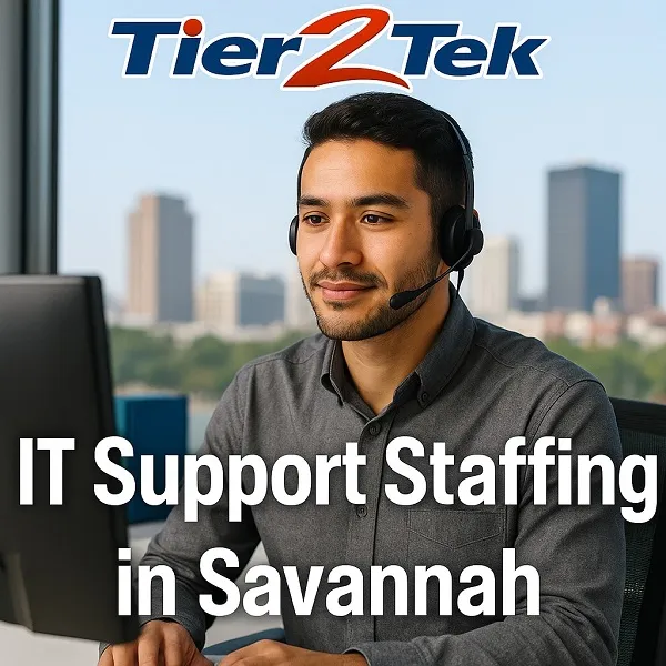 IT support professional working at a desk with Savannah skyline in background