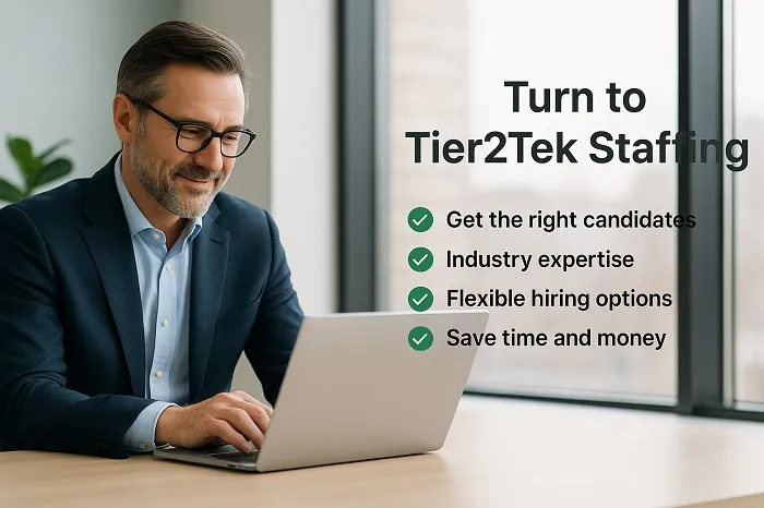 Professional reviewing laptop with Tier2Tek Staffing benefits listed.