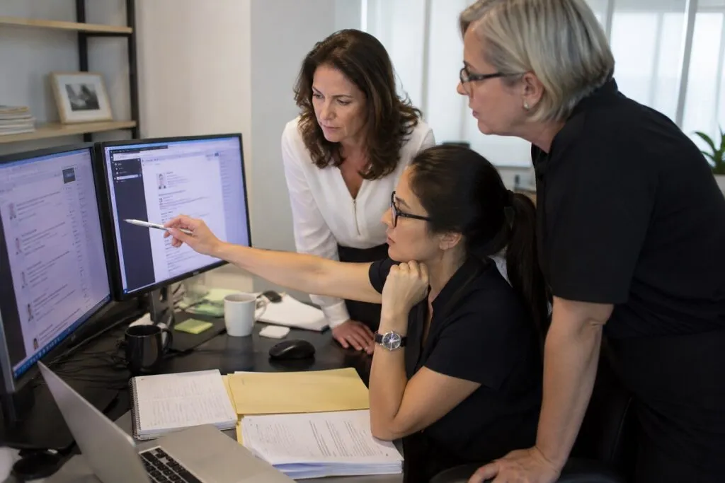 HR leaders reviewing resumes and evaluating Revit candidates to identify qualified BIM and CAD professionals.