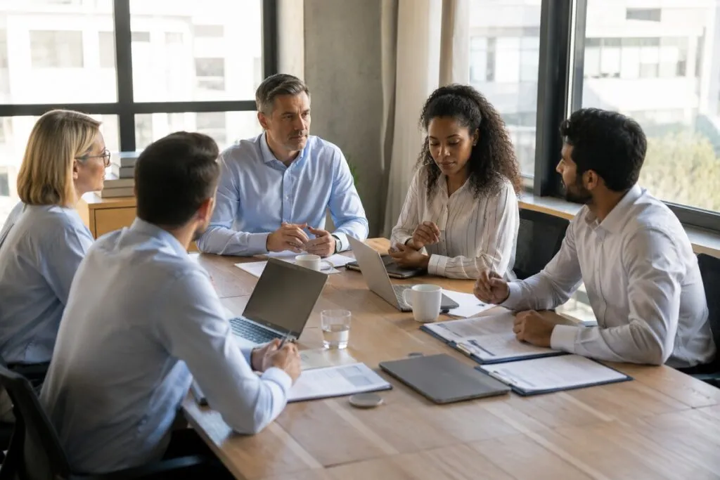 IT leadership team discussing enterprise infrastructure strategy, technology planning, and operational priorities during a collaborative meeting.