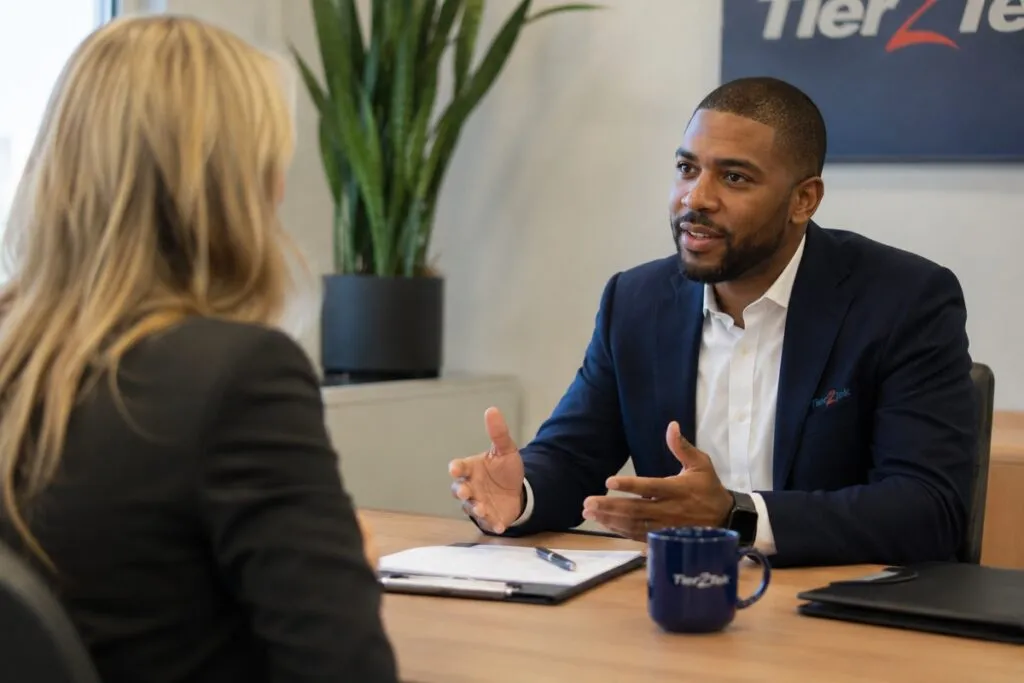 Tier2Tek recruiter interviewing a professional candidate to assess qualifications, experience, and career fit.